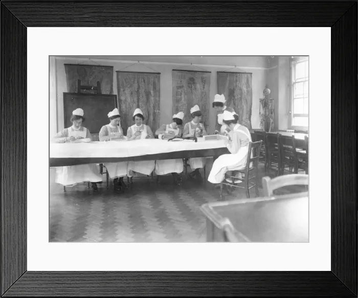 Framed Print : Student nurses working with bandages Framed Print : Student nurses working with bandages