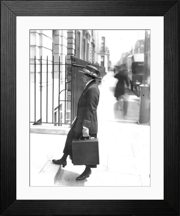 Framed Print : Secretary carrying a typewriter Framed Print : Secretary carrying a typewriter