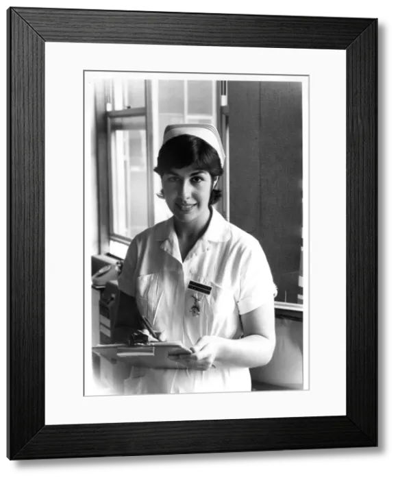 Framed Print : Nurse holding a clipboard Framed Print : Nurse holding a clipboard