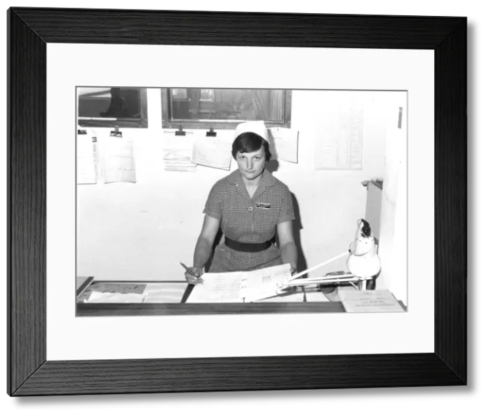 Framed Print : Nurse at desk Framed Print : Nurse at desk