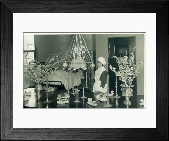 Framed Print : Nurse with Christmas decorations and flowers Framed Print : Nurse with Christmas decorations and flowers