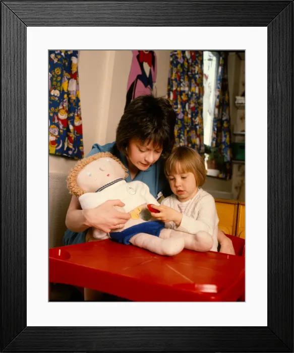 Framed Print : Nurse with child and doll Framed Print : Nurse with child and doll