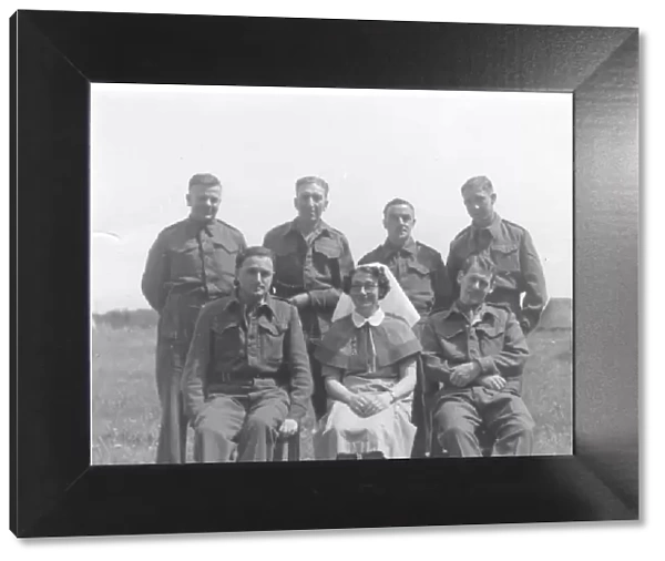 Nurse with group of servicemen