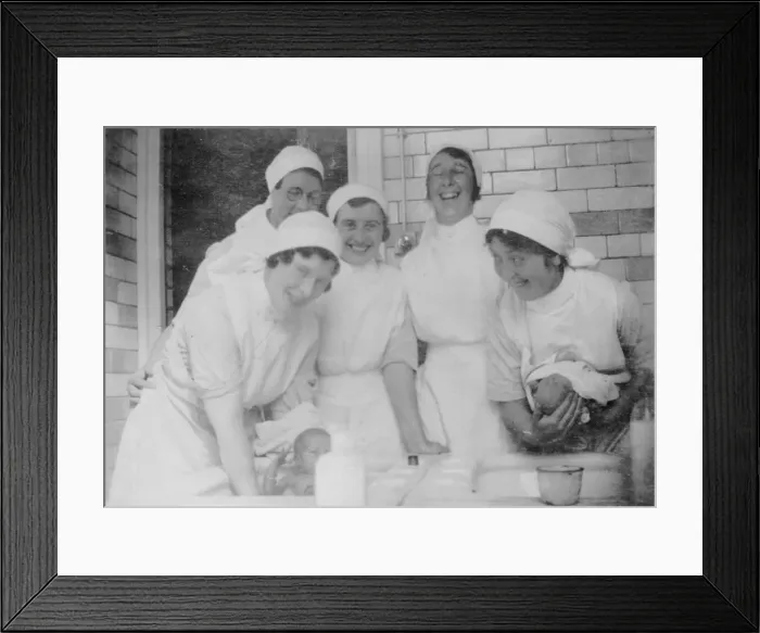 Framed Print : Nurses bathing babies Framed Print : Nurses bathing babies