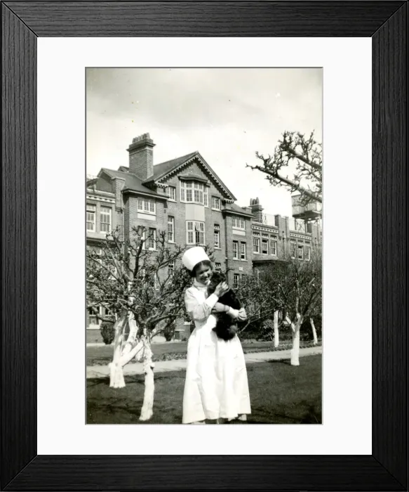 Framed Print : Nurse holding cat Framed Print : Nurse holding cat