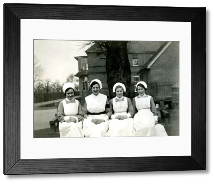 Framed Print : Nurses on bench outside hospital Framed Print : Nurses on bench outside hospital