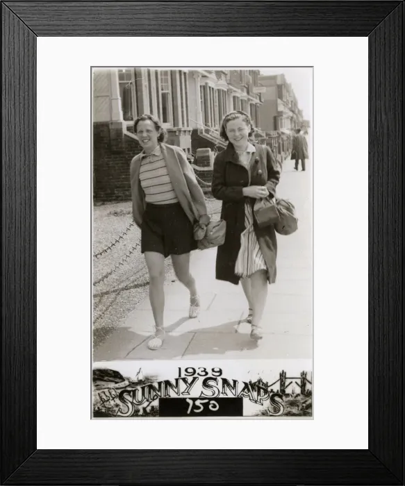 Framed Print : Two women walking down a London Street - Summer Framed Print : Two women walking down a London Street - Summer