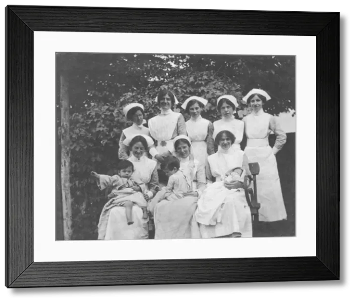 Framed Print : Group of nurses and children outdoors Framed Print : Group of nurses and children outdoors