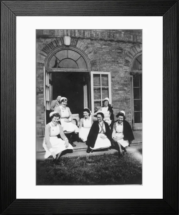 Framed Print : Six nurses and woman on steps Framed Print : Six nurses and woman on steps