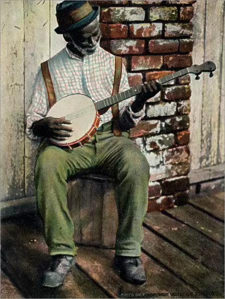 Old Black Man playing the Banjo