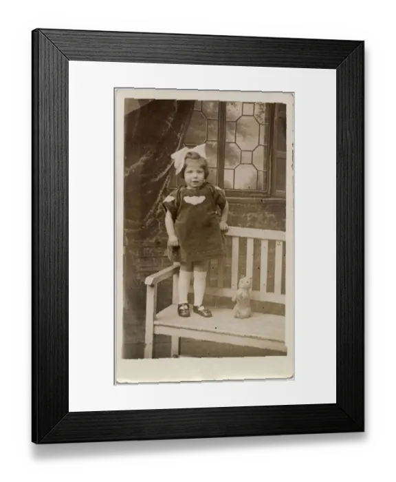 Framed Print : TOY CAT, a little girl with an enormous bow in her hair stands on a garden bench with her Framed Print : TOY CAT, a little girl with an enormous bow in her hair stands on a garden bench with her