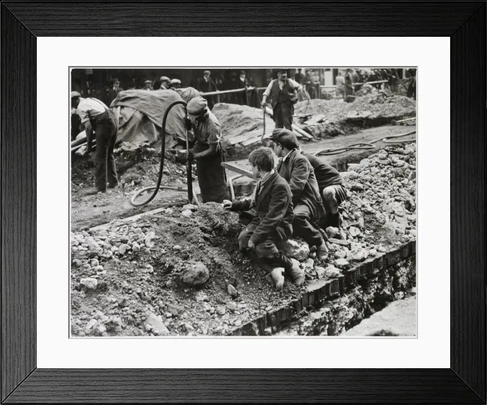 Framed Print : Three scruffy boys watch the men digging up the road in Piccadilly Framed Print : Three scruffy boys watch the men digging up the road in Piccadilly