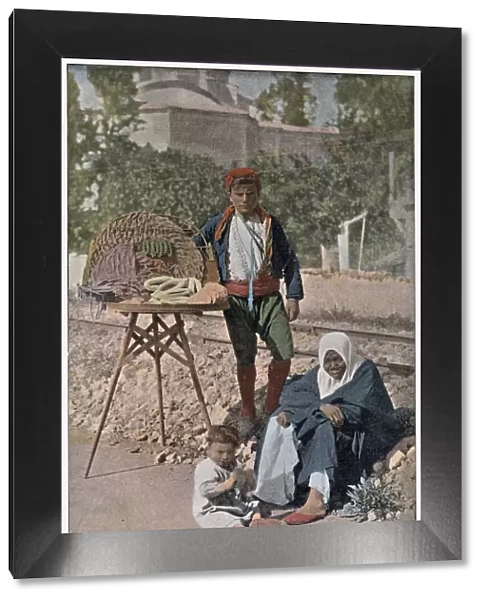 A young Turkish man selling sweets and cakes on the streets of Istanbul Date: 1890s
