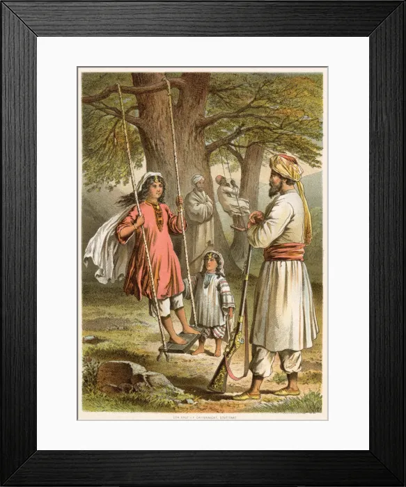 Framed Print : An Afghan man watches his children play on the swings, whilst keeping his rifle handy