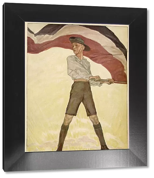 A German youth, with the national flag. Date: 1916