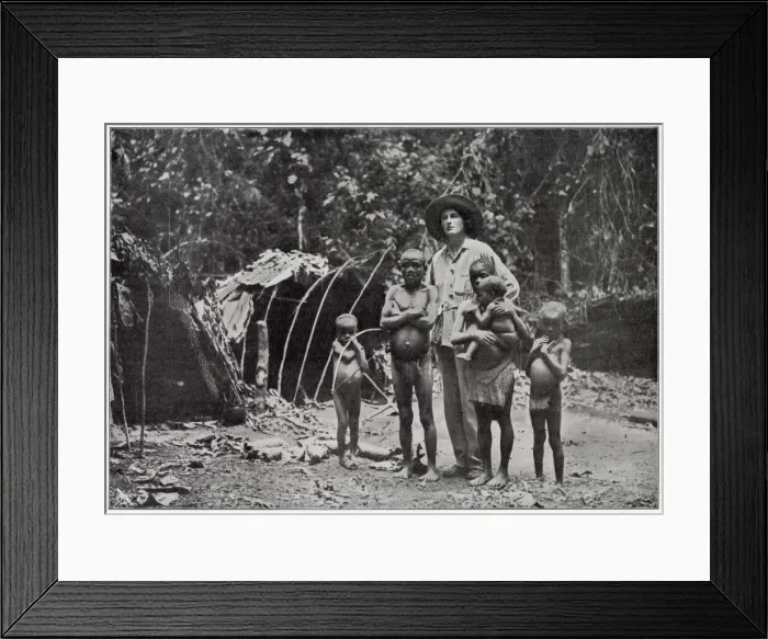Framed Print : Lady Broughton, travelling in southern Africa, poses with a family of pygmies Framed Print : Lady Broughton, travelling in southern Africa, poses with a family of pygmies