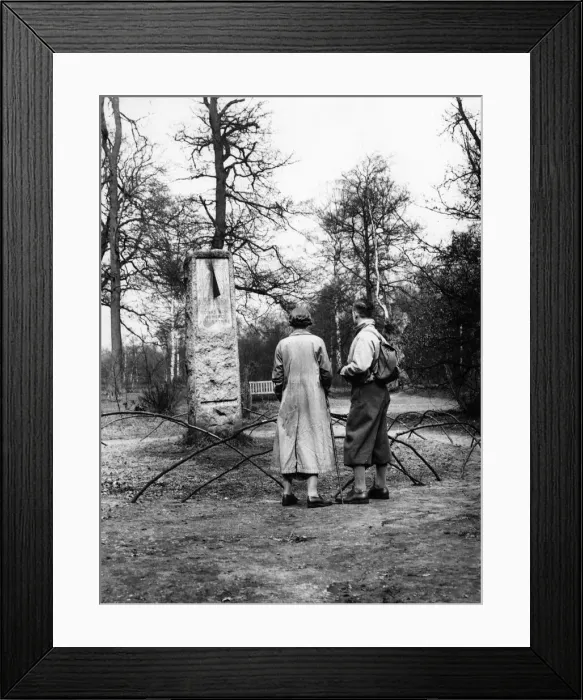 Framed Print : A couple of hikers stop to read the inscription on the sundial monument to daylight Framed Print : A couple of hikers stop to read the inscription on the sundial monument to daylight