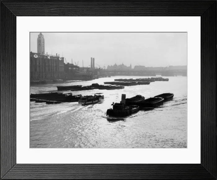 Framed Print : A tug and lighters, from Blackfriars, with the OXO tower on the opposite bank Framed Print : A tug and lighters, from Blackfriars, with the OXO tower on the opposite bank