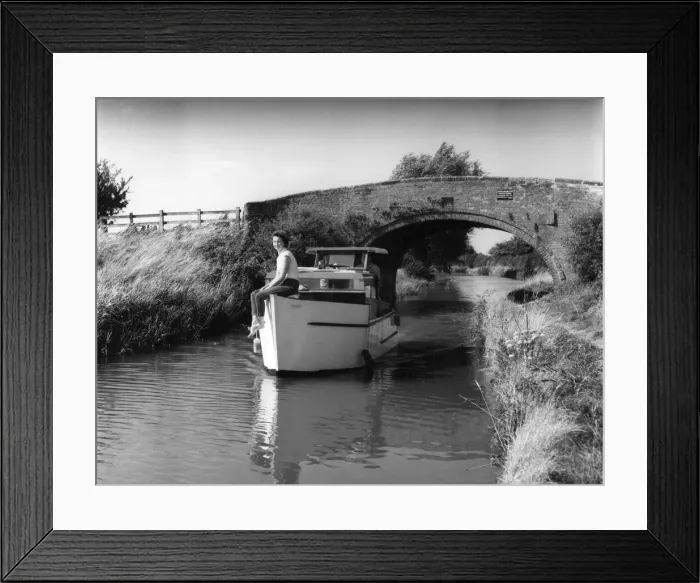 Framed Print : A motor cruiser on a quiet and peaceful stretch of the Oxford Canal, near Claydon Framed Print : A motor cruiser on a quiet and peaceful stretch of the Oxford Canal, near Claydon