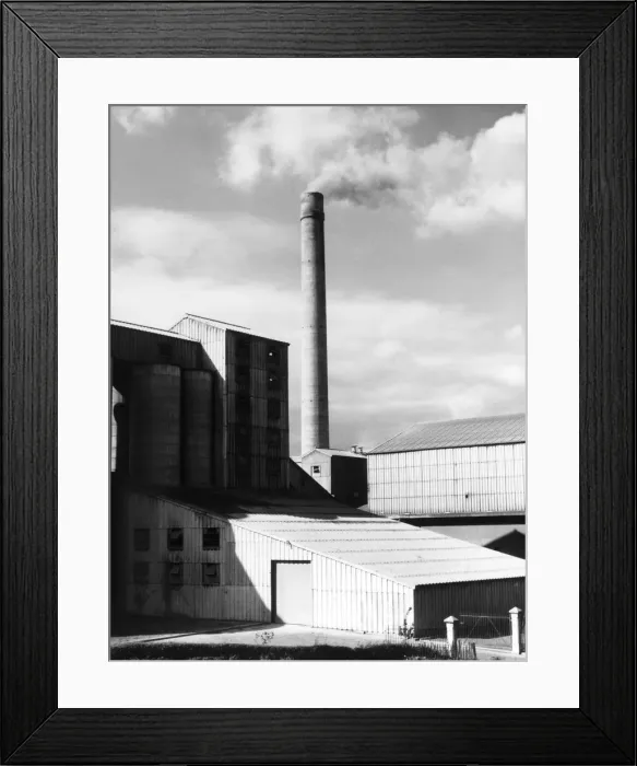 Framed Print : The buildings and smoking tower of a cement works in Great Britain. Date: 1950s Framed Print : The buildings and smoking tower of a cement works in Great Britain. Date: 1950s