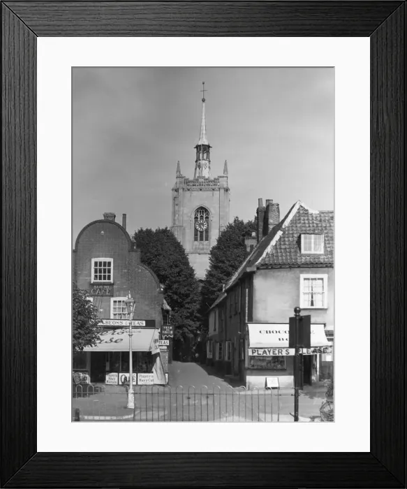 Framed Print : Shops and the church, viewed from the Market Place, Swaffam, Norfolk, England Framed Print : Shops and the church, viewed from the Market Place, Swaffam, Norfolk, England
