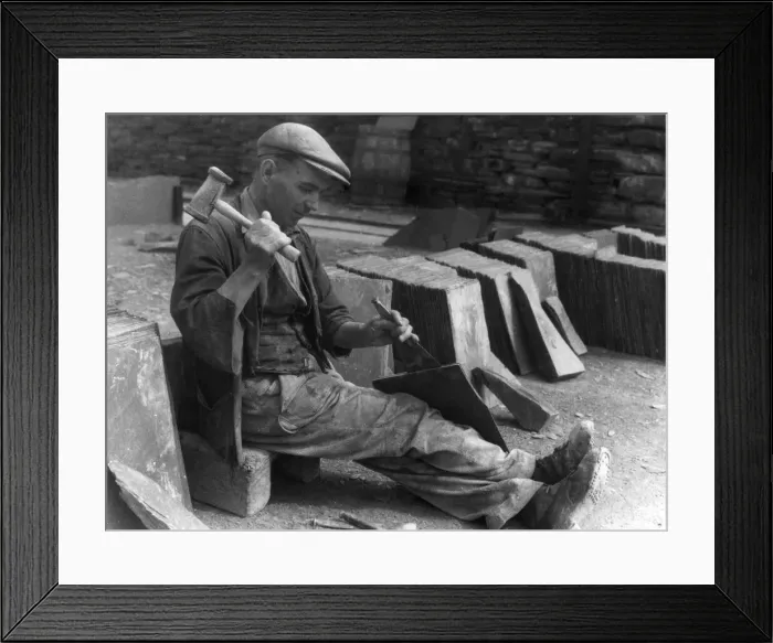 Framed Print : A workman splitting slates in one of the biggest slate quarries in the world Framed Print : A workman splitting slates in one of the biggest slate quarries in the world
