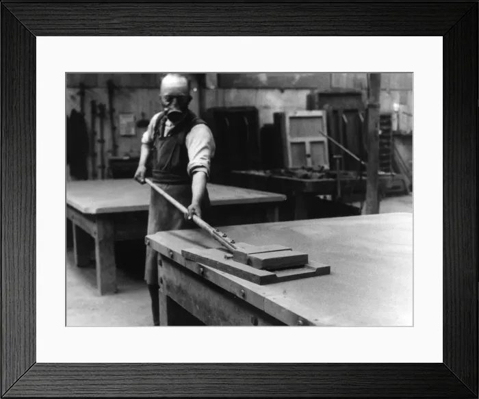 Framed Print : A workman smoothing the surface of the slate bed of a billiard table at a factory in Framed Print : A workman smoothing the surface of the slate bed of a billiard table at a factory in