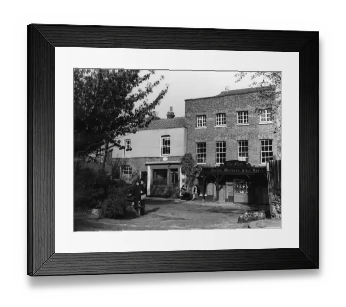 Framed Print : An old lady in a bath chair relaxes with a younger female companion outside Framed Print : An old lady in a bath chair relaxes with a younger female companion outside