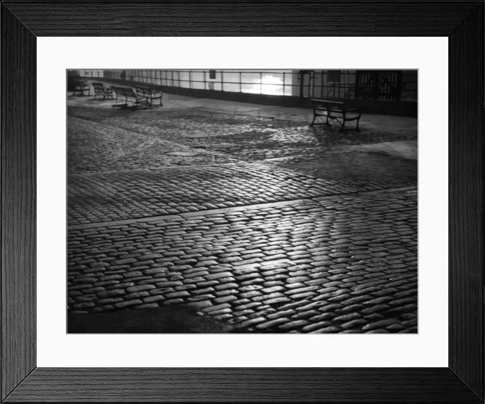 Framed Print : A fine pattern study of granite cobbled stone sets on an unspecified British sea front