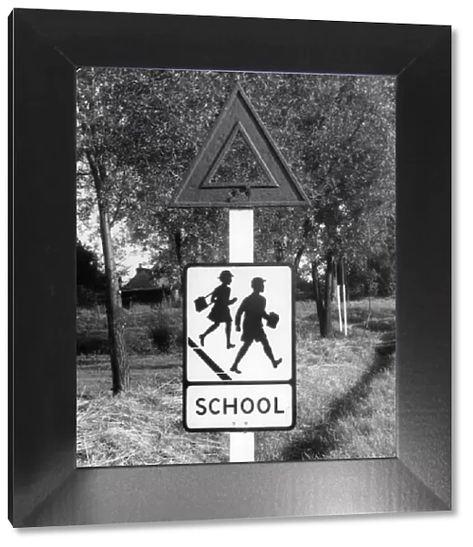 School - the pictorial traffic sign which replaced a former torch sign