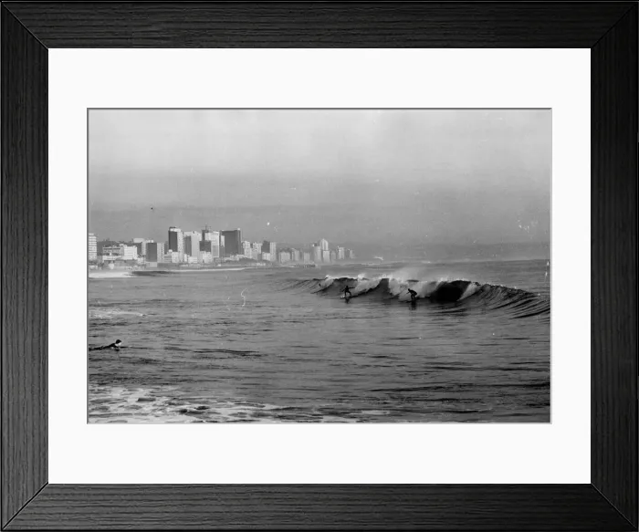 Framed Print : Surfing at Durban, South Africa. Date: late 1960s Framed Print : Surfing at Durban, South Africa. Date: late 1960s