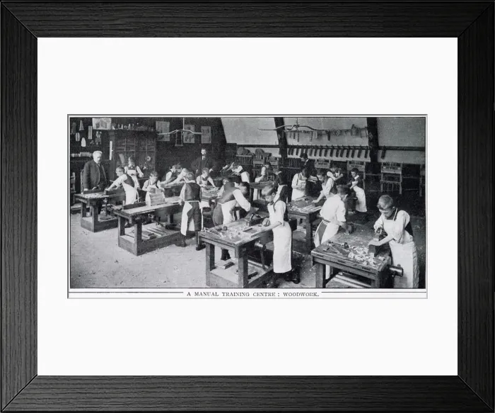 Framed Print : Boys at workbenches learning how to use plane Framed Print : Boys at workbenches learning how to use plane