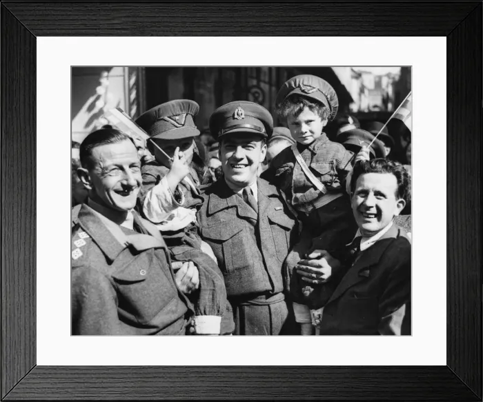 Framed Print : Two Belgian boys dressed as British soldiers with adults during World War II Framed Print : Two Belgian boys dressed as British soldiers with adults during World War II