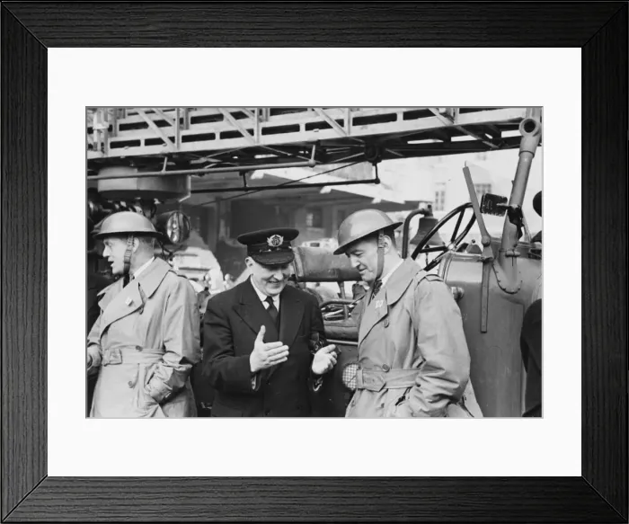 Framed Print : Major Jackson, Chief of the London Fire Brigade, explaining a print to Battalion Chief Framed Print : Major Jackson, Chief of the London Fire Brigade, explaining a print to Battalion Chief