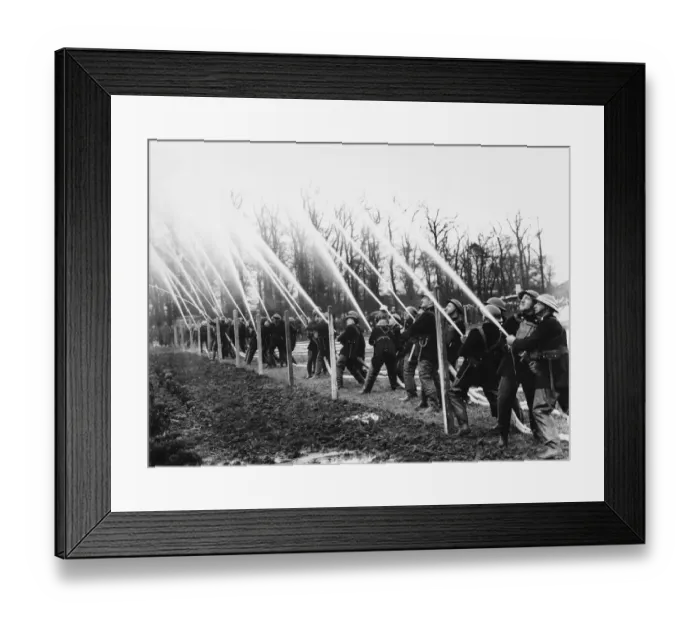 Framed Print : Firemen at hose drill during World War II Date: 1941 Framed Print : Firemen at hose drill during World War II Date: 1941