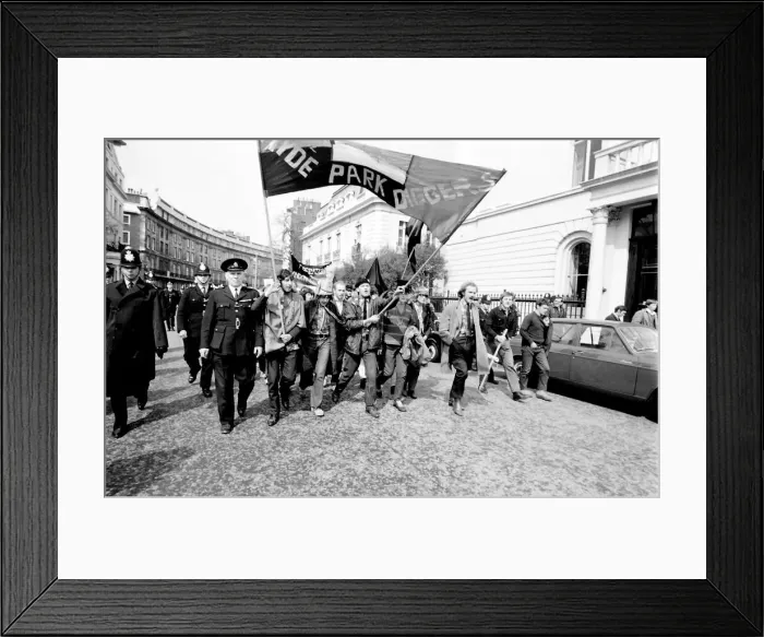 Framed Print : Demonstration in London -- young protesters walking along a road with a banner belonging Framed Print : Demonstration in London -- young protesters walking along a road with a banner belonging