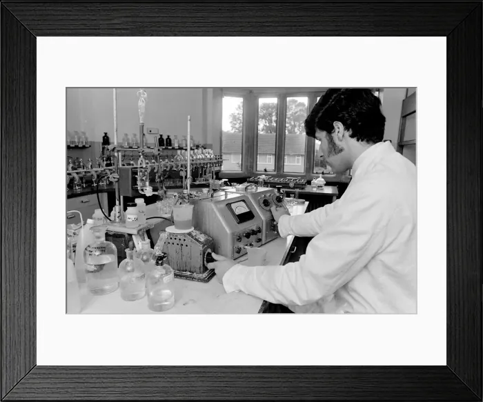 Framed Print : Horse doping tests -- a laboratory technician in a white coat turns a knob on a machine Framed Print : Horse doping tests -- a laboratory technician in a white coat turns a knob on a machine