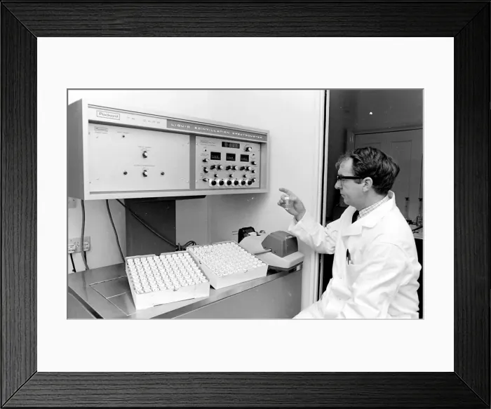 Framed Print : Horse doping tests -- a laboratory technician in a white coat sits in front of a Packard Framed Print : Horse doping tests -- a laboratory technician in a white coat sits in front of a Packard