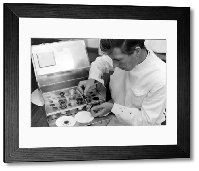 Framed Print : Scientist examining and testing a locust at the Anti-Locust Research Centre (ALRC) Framed Print : Scientist examining and testing a locust at the Anti-Locust Research Centre (ALRC)