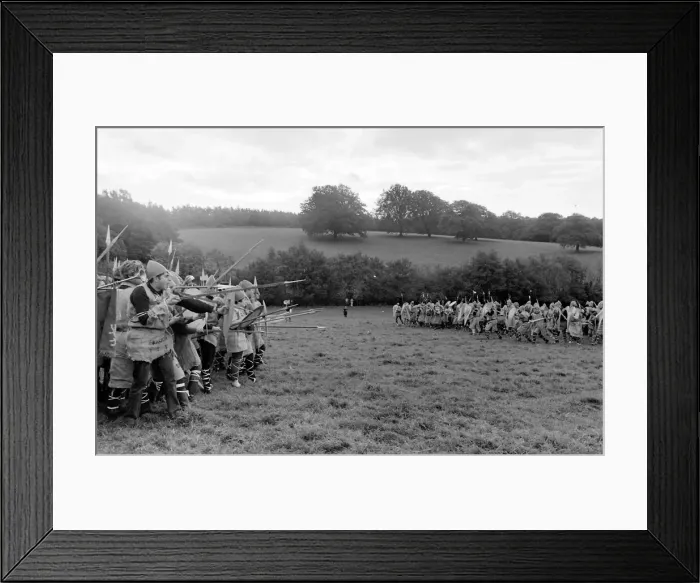 Framed Print : Battle of Hastings re-enactment. With cross-gartered jeans and dyed sackcloth doublets Framed Print : Battle of Hastings re-enactment. With cross-gartered jeans and dyed sackcloth doublets