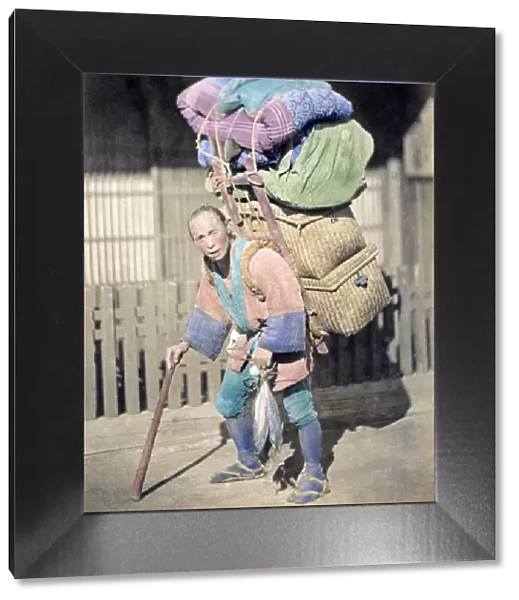 Porter with a heavy load, Japan, circa 1870s. Date: circa 1870s