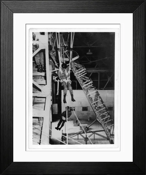 Framed Print : Thai paratroop trainee practising a treescape - parachute Framed Print : Thai paratroop trainee practising a treescape - parachute