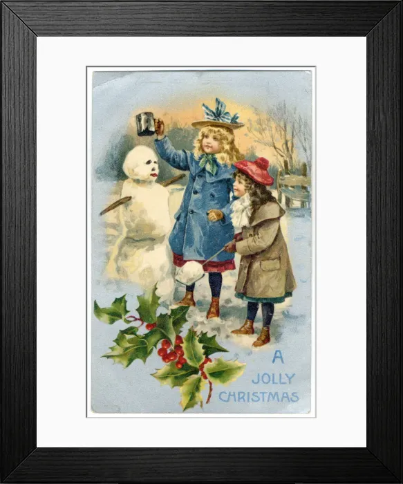 Framed Print : Two girls crowning their snowman Framed Print : Two girls crowning their snowman
