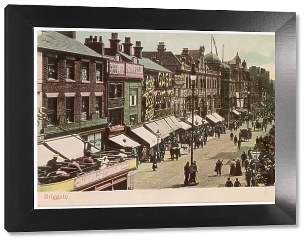 Leeds, Yorkshire: Briggate on a busy shopping day Date: circa 1902
