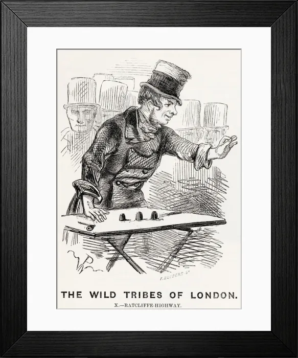 Framed Print : A thimble-rigger in a London street tries to trick members of the crowd with clever Framed Print : A thimble-rigger in a London street tries to trick members of the crowd with clever