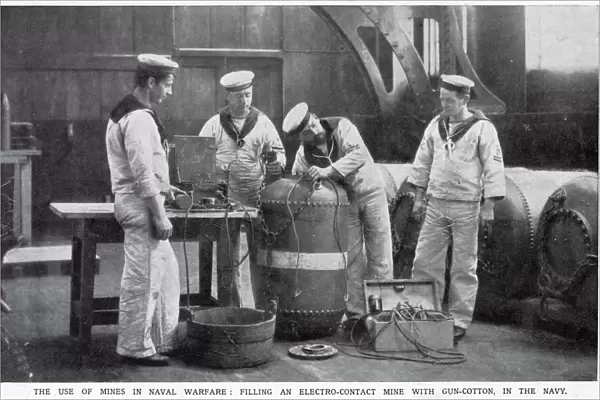 Filling an electro-contact mine with gun-cotton in the Navy. Date: August 1914