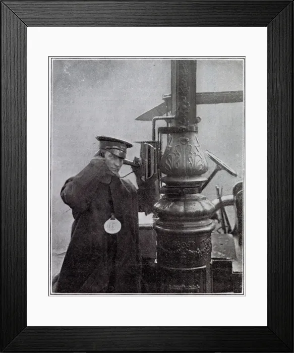 Framed Print : A call-box attached to the electric lighting standard at a cab-rank in Kensington, London Framed Print : A call-box attached to the electric lighting standard at a cab-rank in Kensington, London