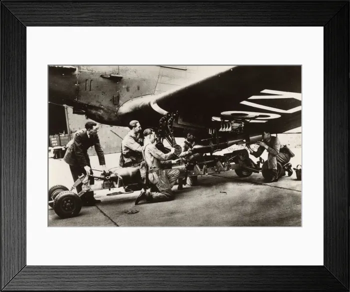 Framed Print : Loading Bombs onto an RAF Bomber prior to a patrol flight Framed Print : Loading Bombs onto an RAF Bomber prior to a patrol flight