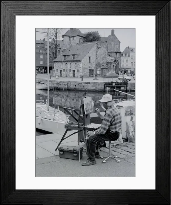 Framed Print : Artist. Seated artist painting a harbour scene at Honfleur Normandie France Date Framed Print : Artist. Seated artist painting a harbour scene at Honfleur Normandie France Date