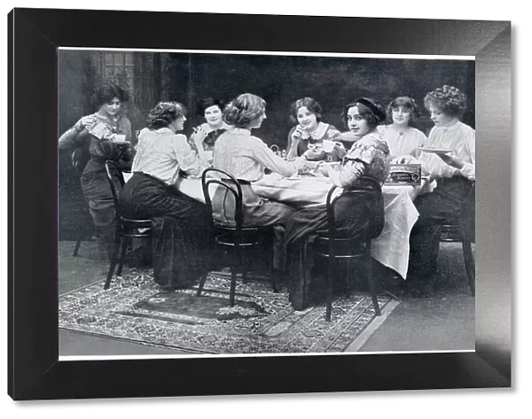 A group of society ladies enjoying a cup of tea and biscuits together. Date: 1910